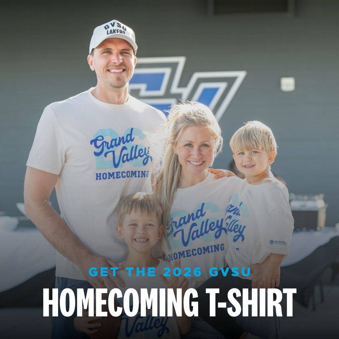 Laker family smiles wearing GVSU Homecoming T-shirts